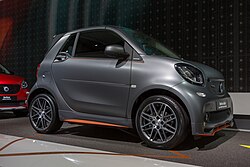 Front three quarter view of matte dark grey third generation Smart fortwo cabrio Brabus, IAA 2017 in Frankfurt.