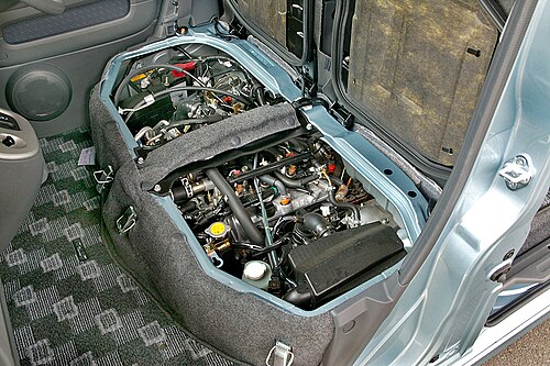The turbocharged EF-DET engine beneath the driver's seat in a 2004-2007 Atrai (S320G)