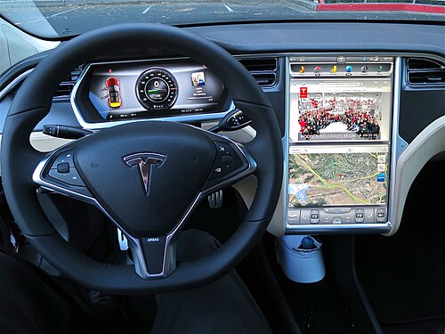 The steering wheel, dashboard, and touchscreen of a Model S