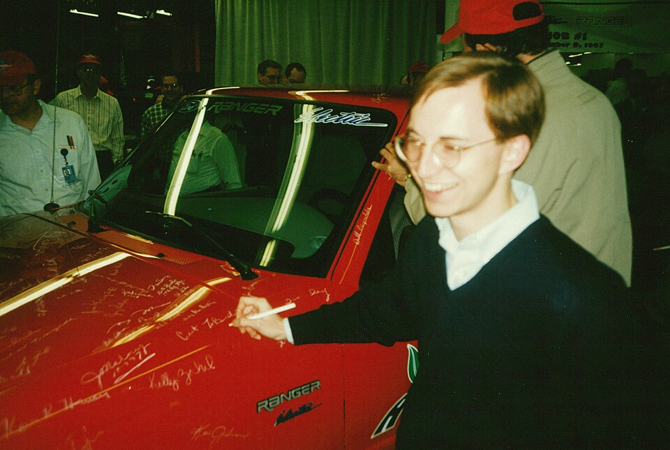 Ford Ranger EV "Job #1" - the first production unit - being signed by a member of Ford's EV Engineering Team during the launch event at the factory in Detroit, Michigan USA in 1998.  This unit, Ford's first-ever production electric vehicle, had just been driven off the assembly line by Ford CEO Alex Trotman.
